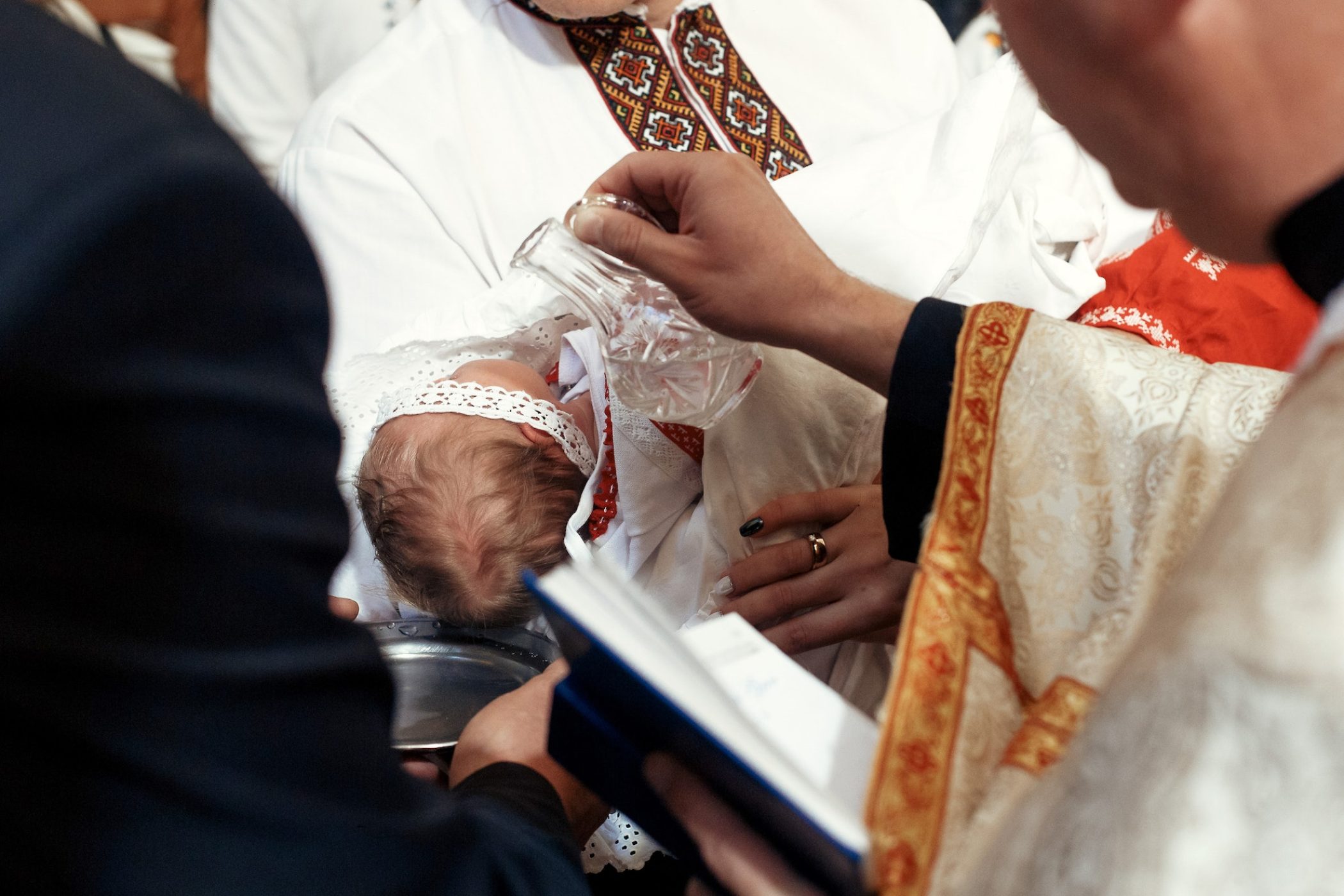 baptism baby. cute little feet of a girl at christening in church
