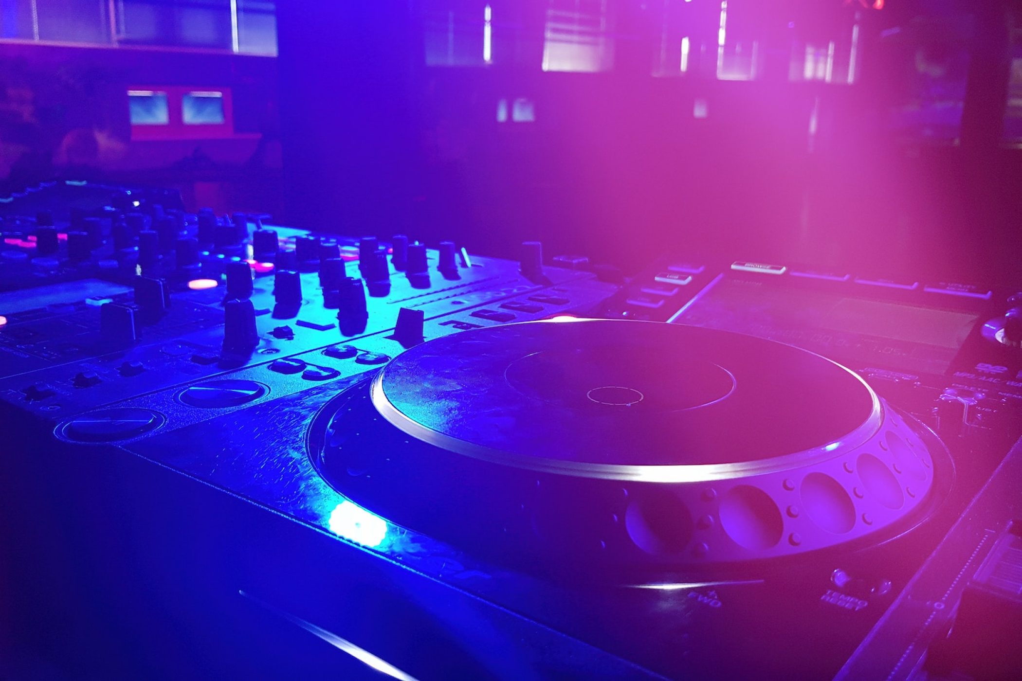 DJ booth at the night club with DJ console, closeup