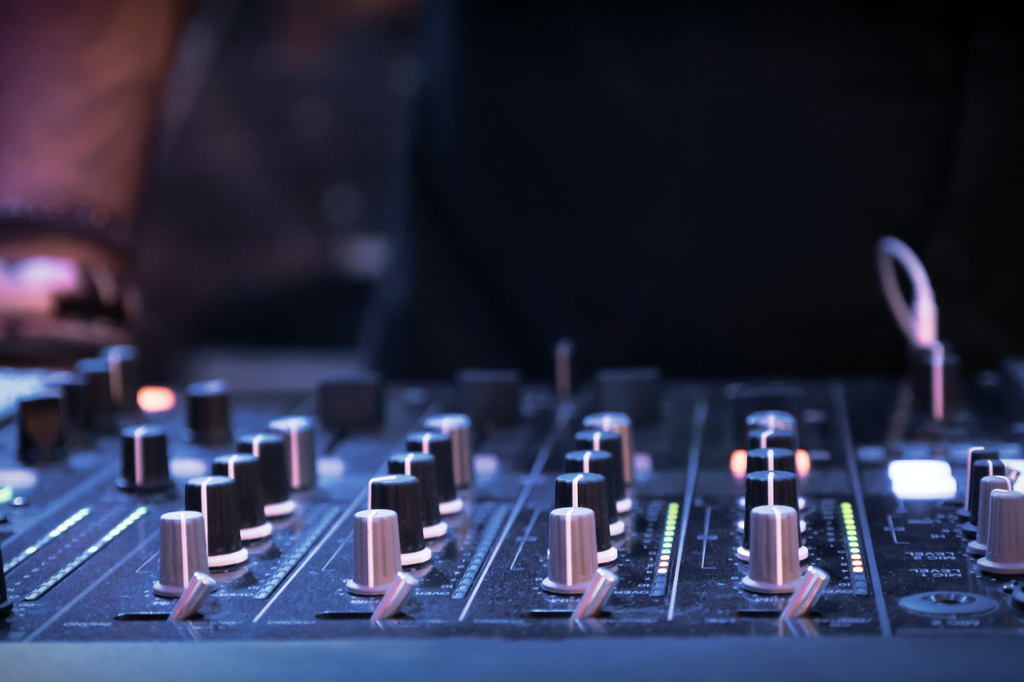 DJ mixer at night in club